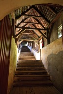 Climbing the steps that lead inside the inner walls, Biertan, Romania.