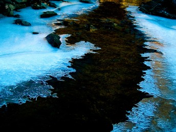 Partially frozen brook, winter, Cabin John Regional Park, MD, USA.