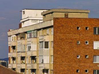 An older apartment building on a bright summer day, Medias, Romania.